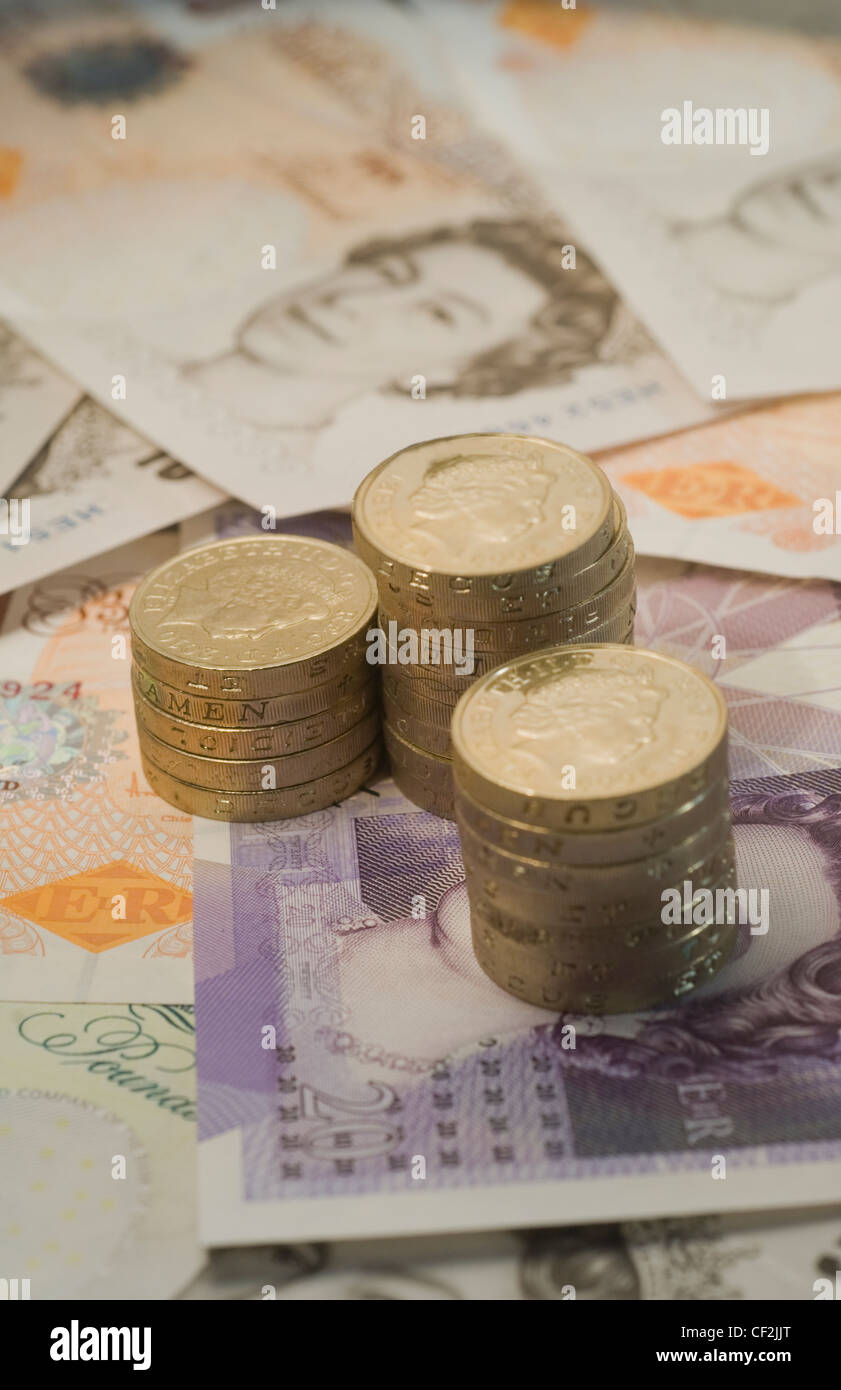 Pound banconote e monete Foto Stock
