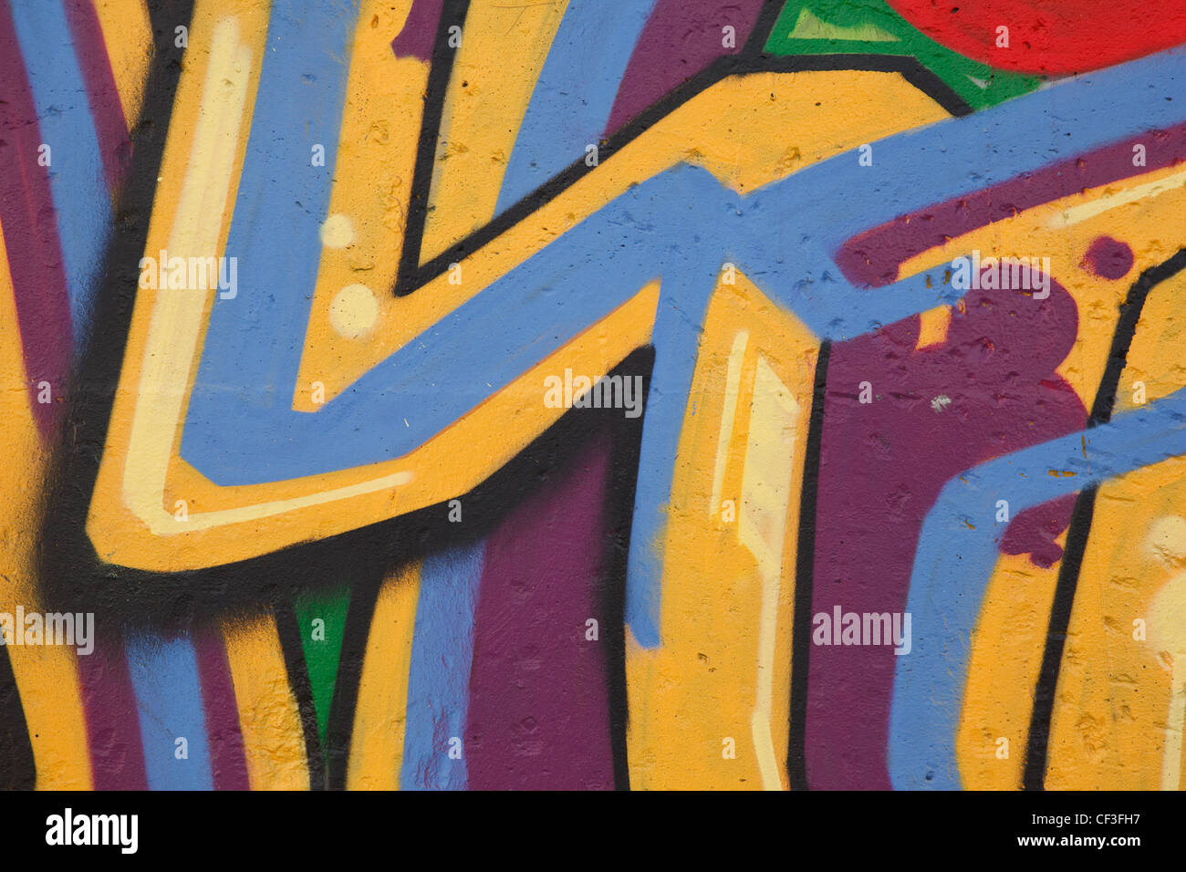 Graffiti luminosi sulla parete di cemento. Disegno astratto. Сlose-up Foto Stock