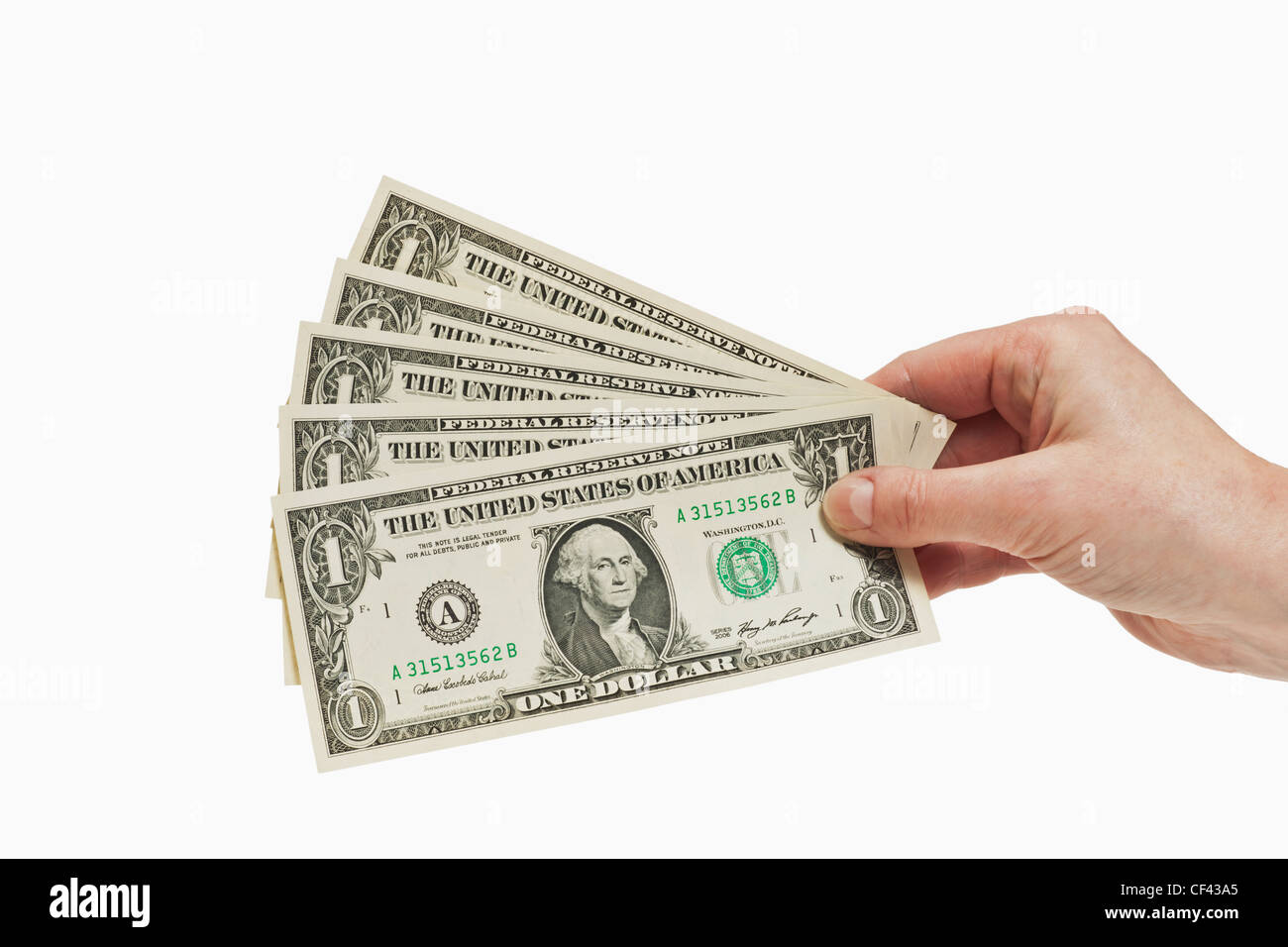 Cinque 1 U.S. Le fatture del dollaro sono tenute in mano, sfondo bianco Foto Stock