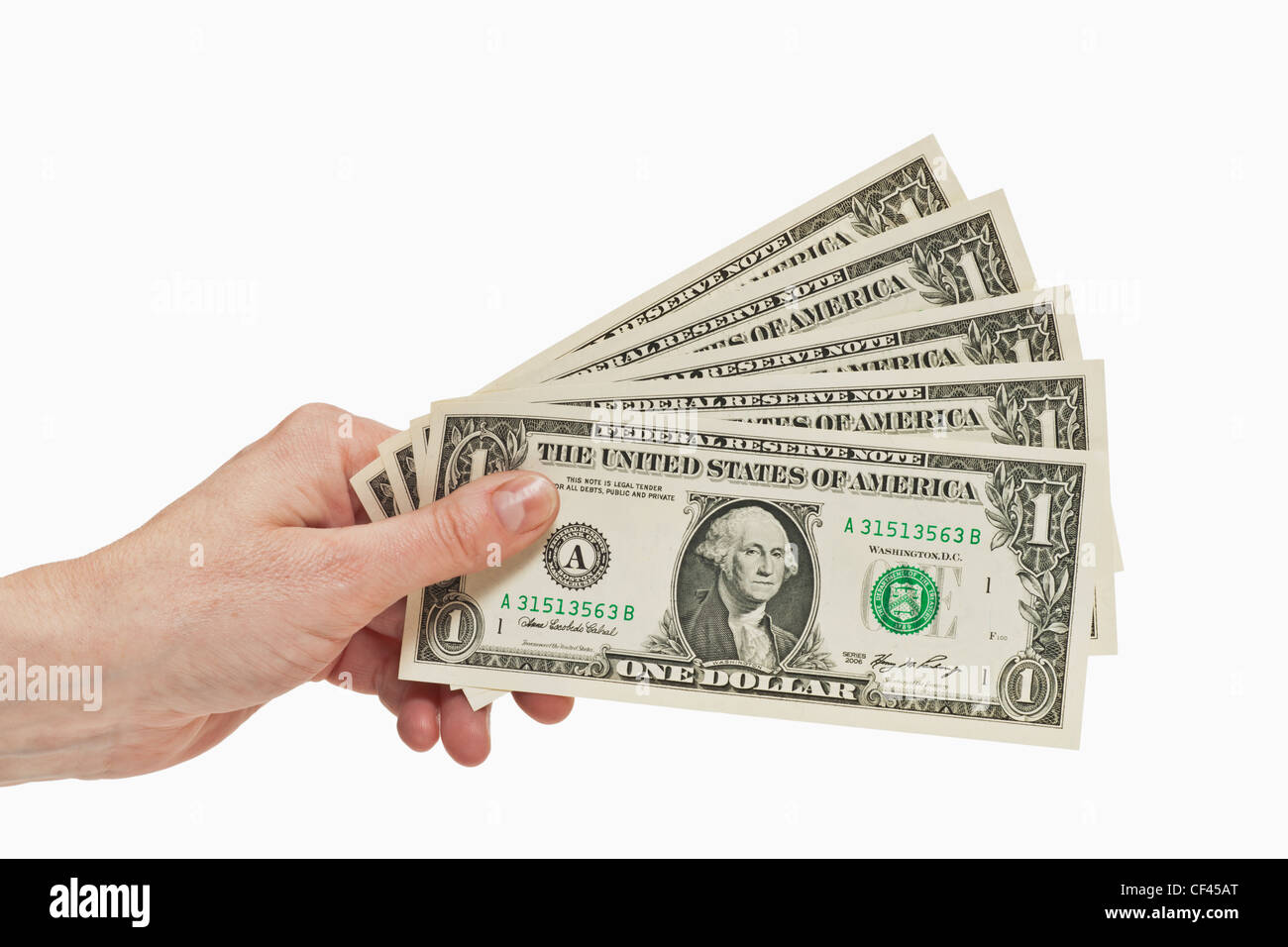 Cinque 1 U.S. Le fatture del dollaro sono tenute in mano, sfondo bianco Foto Stock