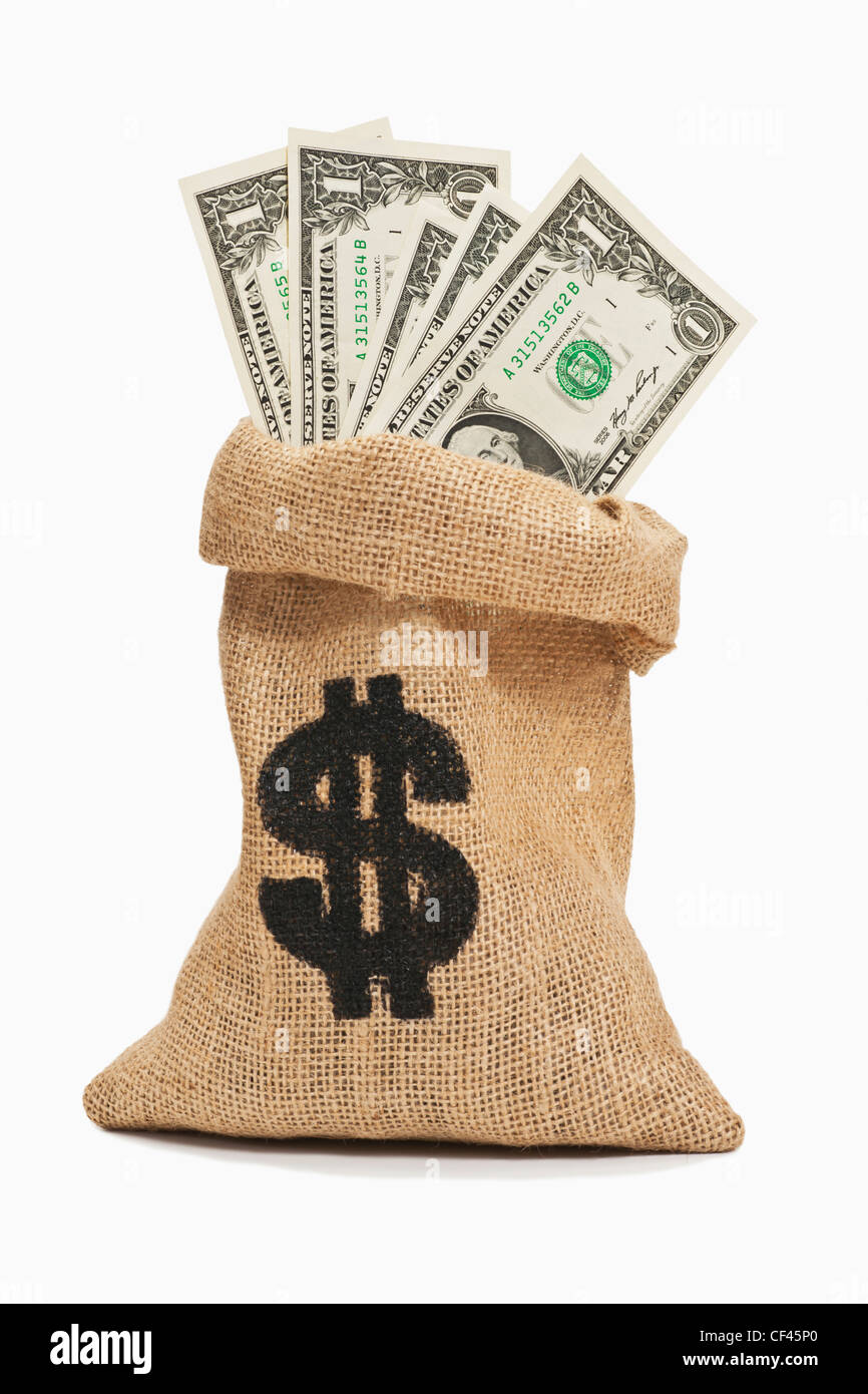 Molti U.S. Dollar Bills con il ritratto di George Washington sono in un sacco di iuta. Foto Stock