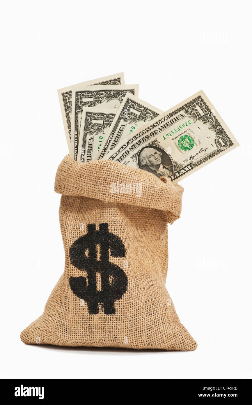 Molti U.S. Dollar Bills con il ritratto di George Washington sono in un sacco di iuta. Foto Stock