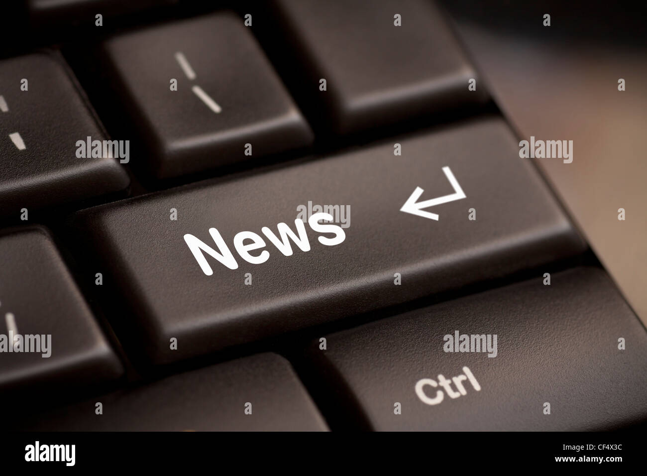 Notizie di un pulsante sulla tastiera del notebook Foto Stock