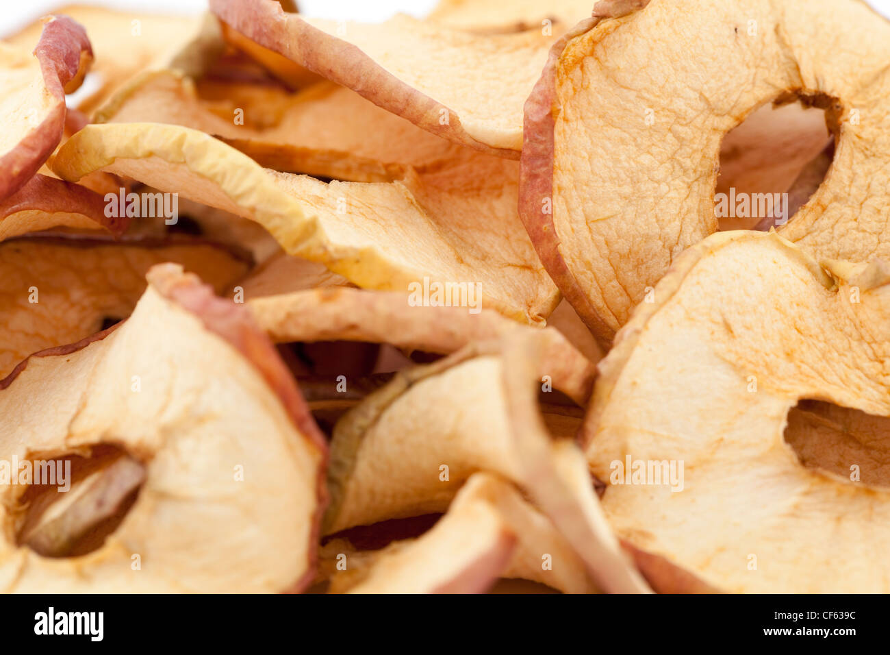 Disposte le fette di mela essiccata come sfondo Foto Stock