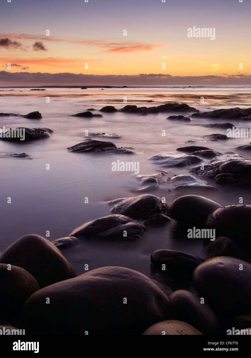 Sunset over Quilva Taing a Huxter sulle Isole Shetland. Foto Stock