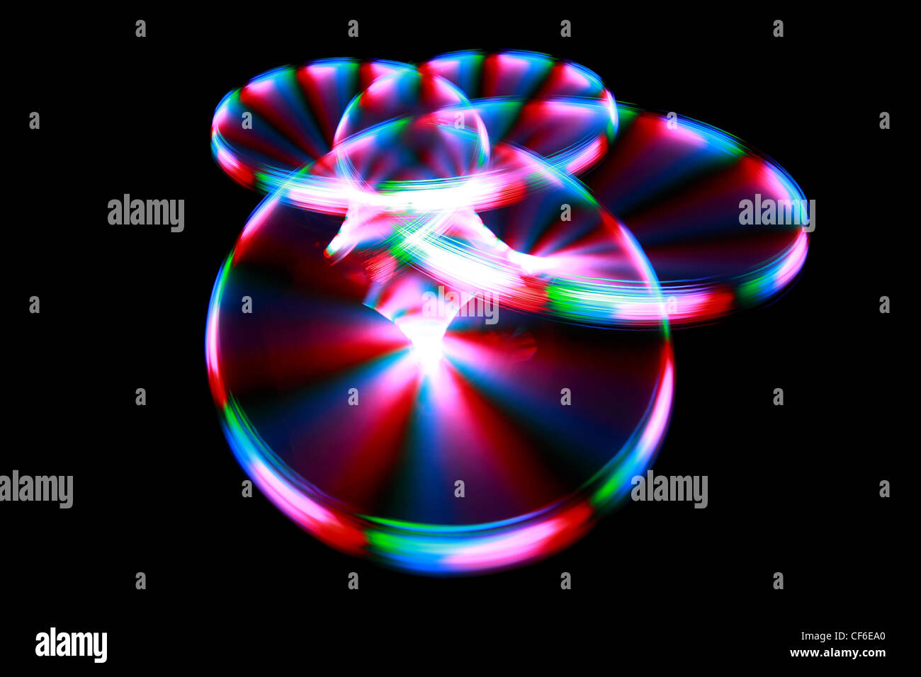 Superficie con luce di striature di pittura durante la rotazione Foto Stock