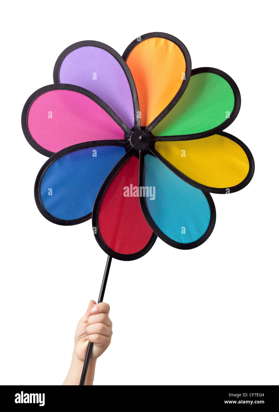 Bimbo a mano che tiene una girandola colorata isolati su sfondo bianco Foto Stock