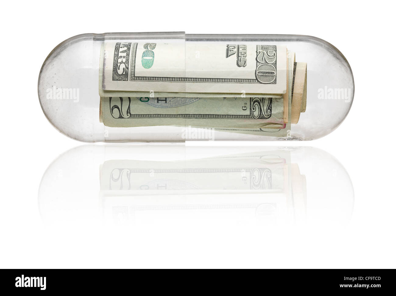 Le fatture del dollaro nella capsula di medicina - i costi sanitari concept Foto Stock