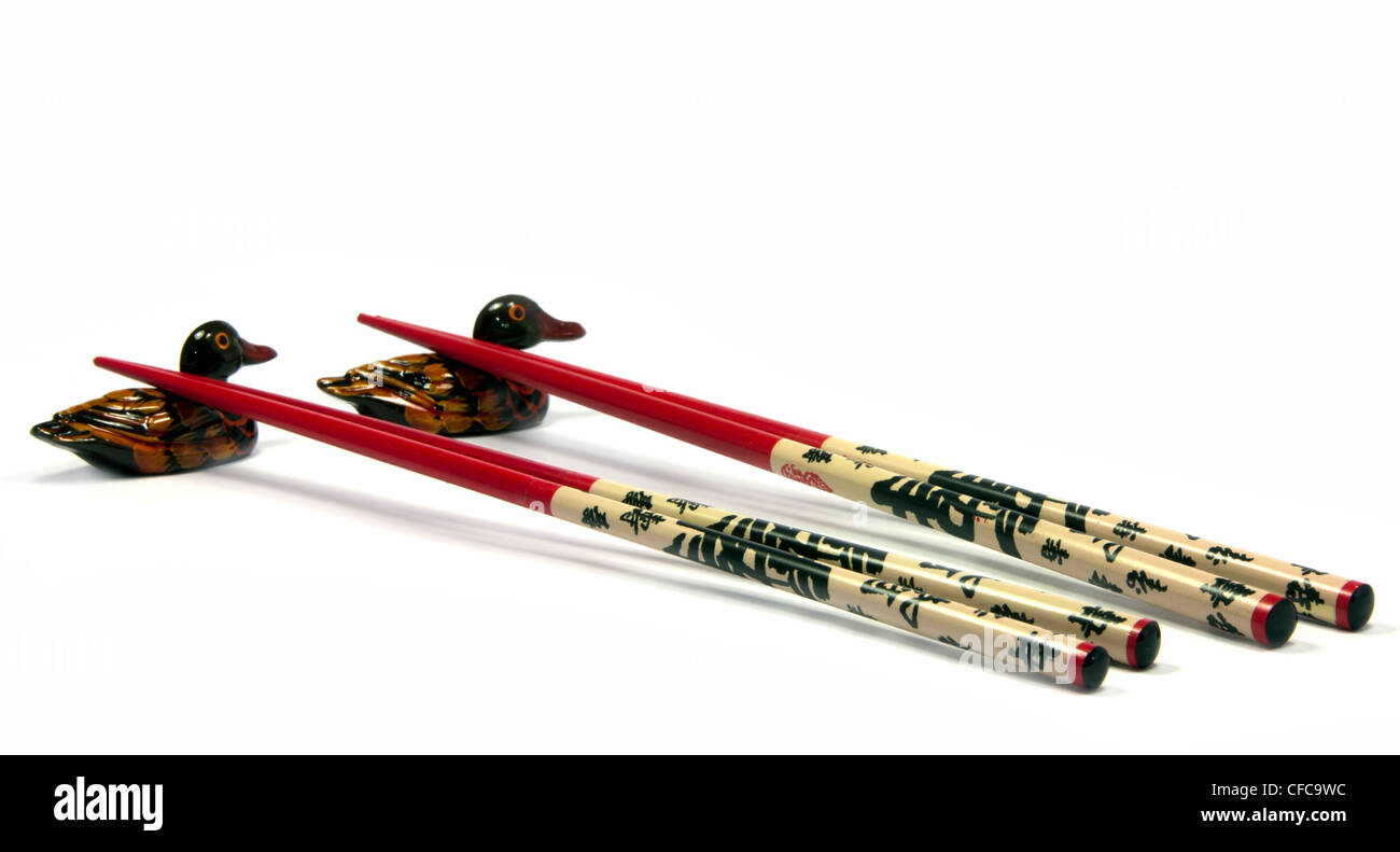 Asia bacchette sui titolari di anatra Foto Stock