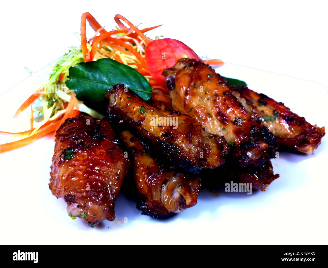 Erbe tailandese alla griglia marinati ali Foto Stock