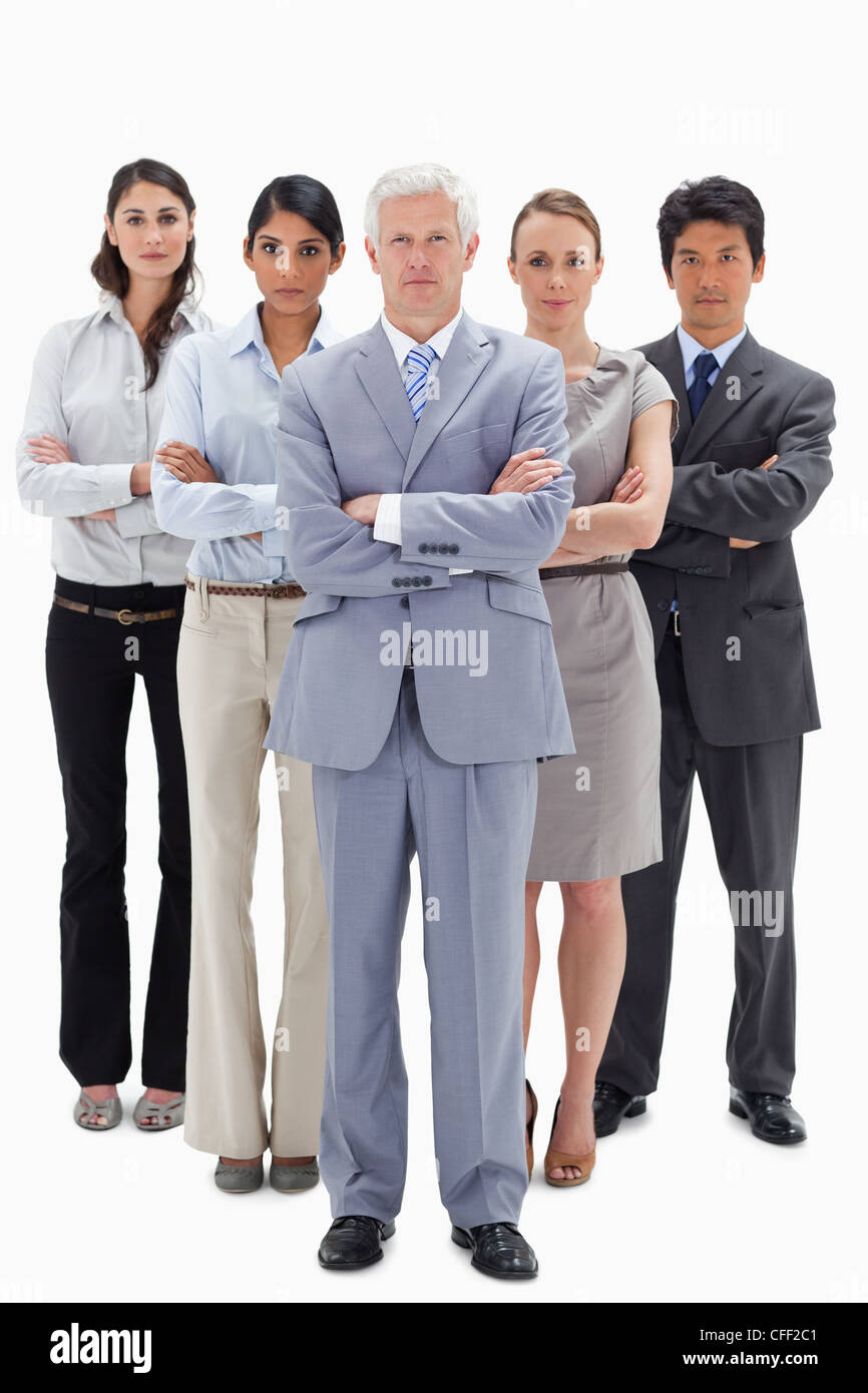 Multiculturale team business dietro il loro capo Foto Stock