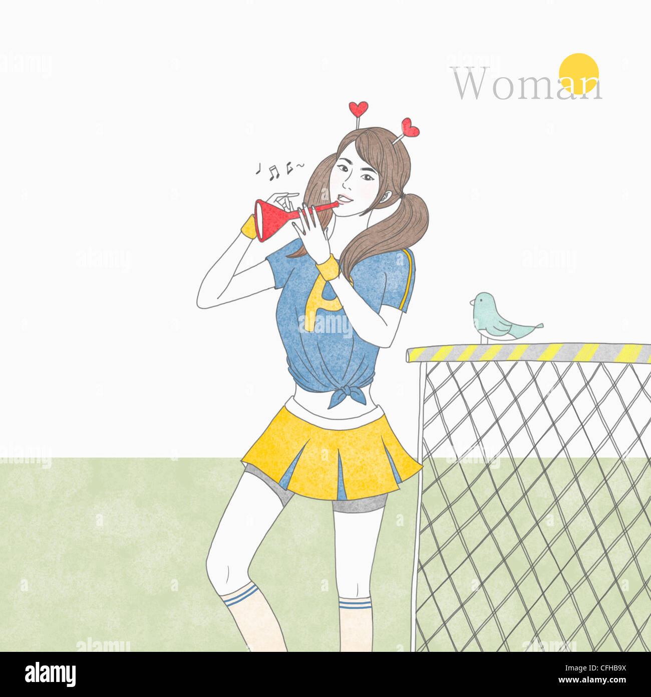 La donna a suonare la tromba per cheerleading Foto Stock