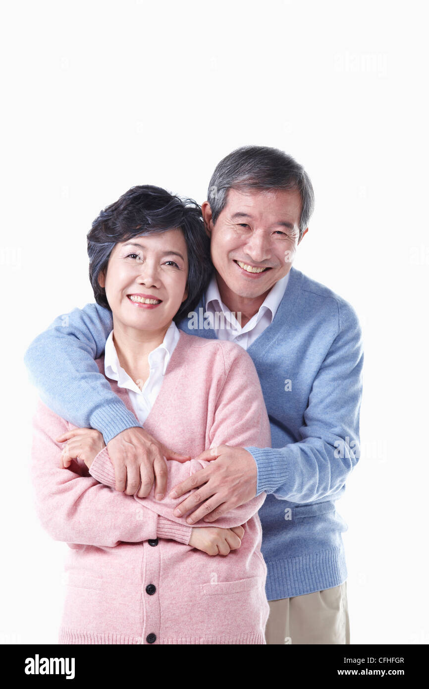L'avvolgente anziano uomo e donna Foto Stock