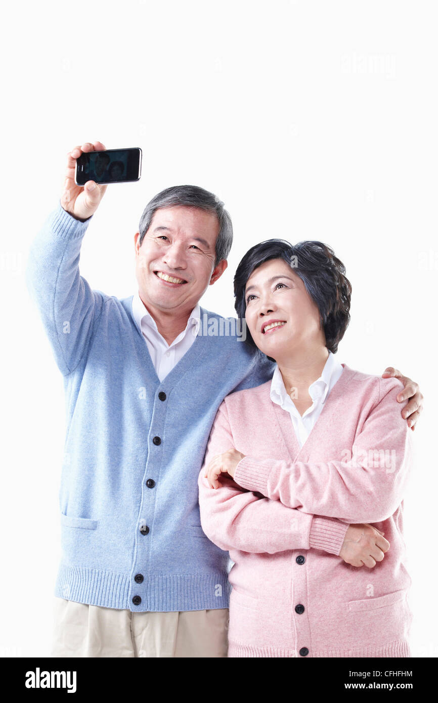 Un anziano uomo e donna fotografare insieme Foto Stock