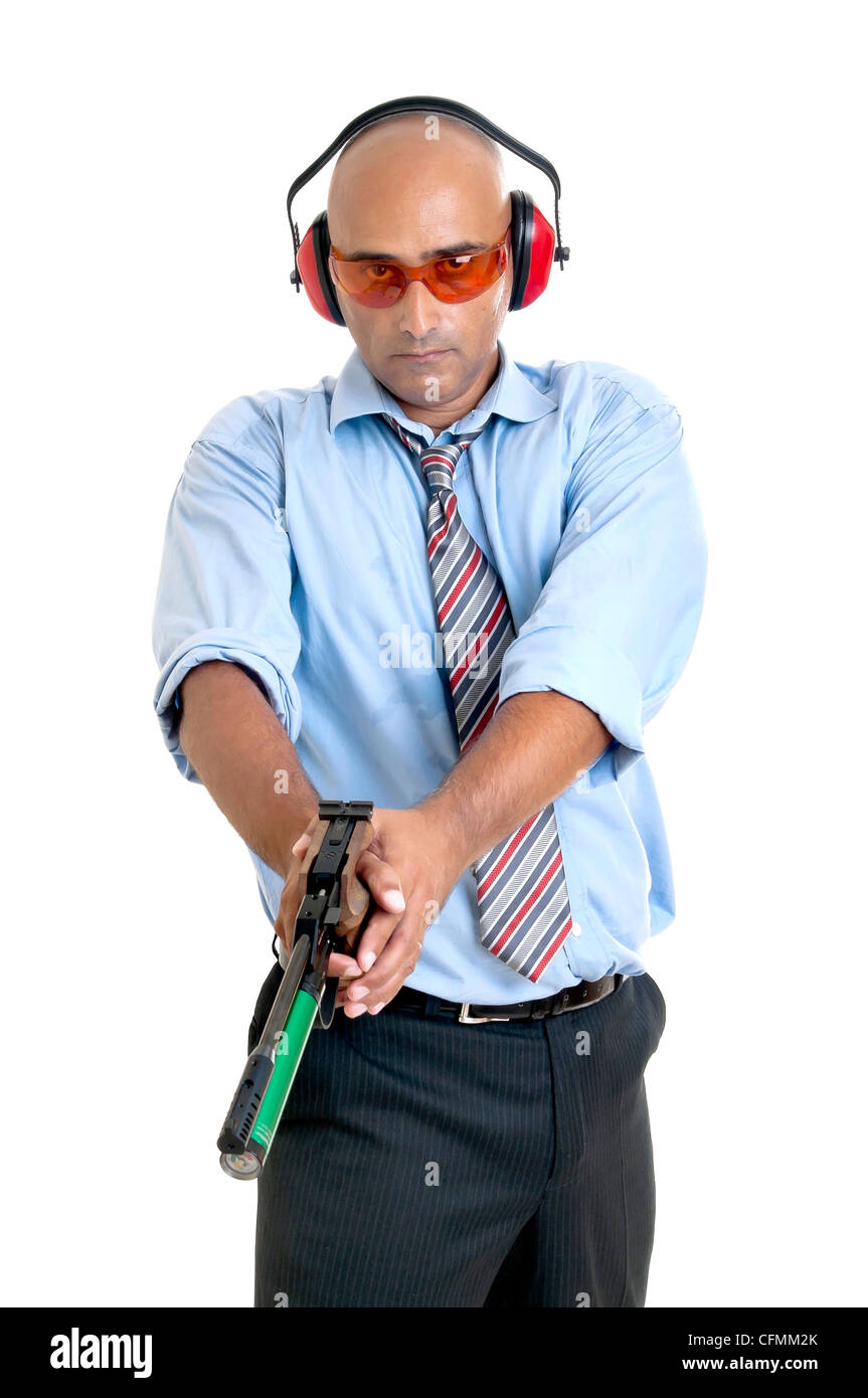 Imprenditore con pistola ad aria compressa Foto Stock