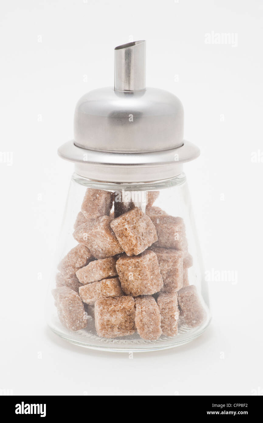 Dosatore zucchero riempite con lo zucchero di canna cubi Foto