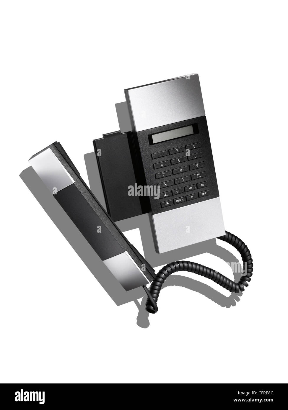 Un moderno ed elegante telefono di linea terrestre su bianco con affiancamento al Creative Foto Stock