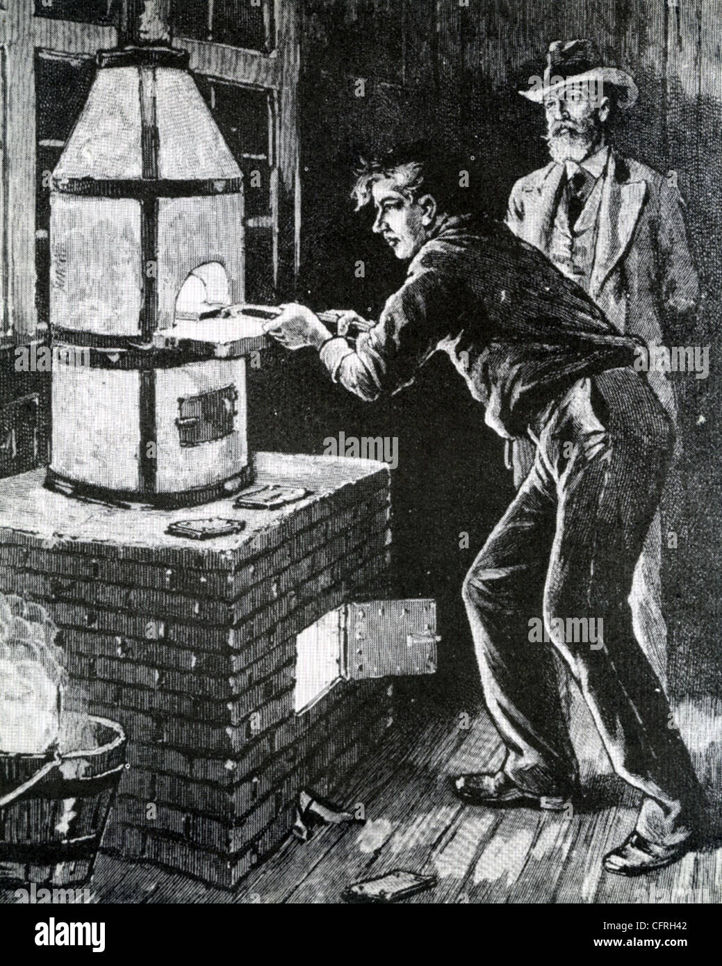 THOMAS EDISON ((1847-1931) orologi come assistente ad un tentativo di carbonizzare una carta del filamento della lampada - un giapponese di bambù rivelata ottimale Foto Stock