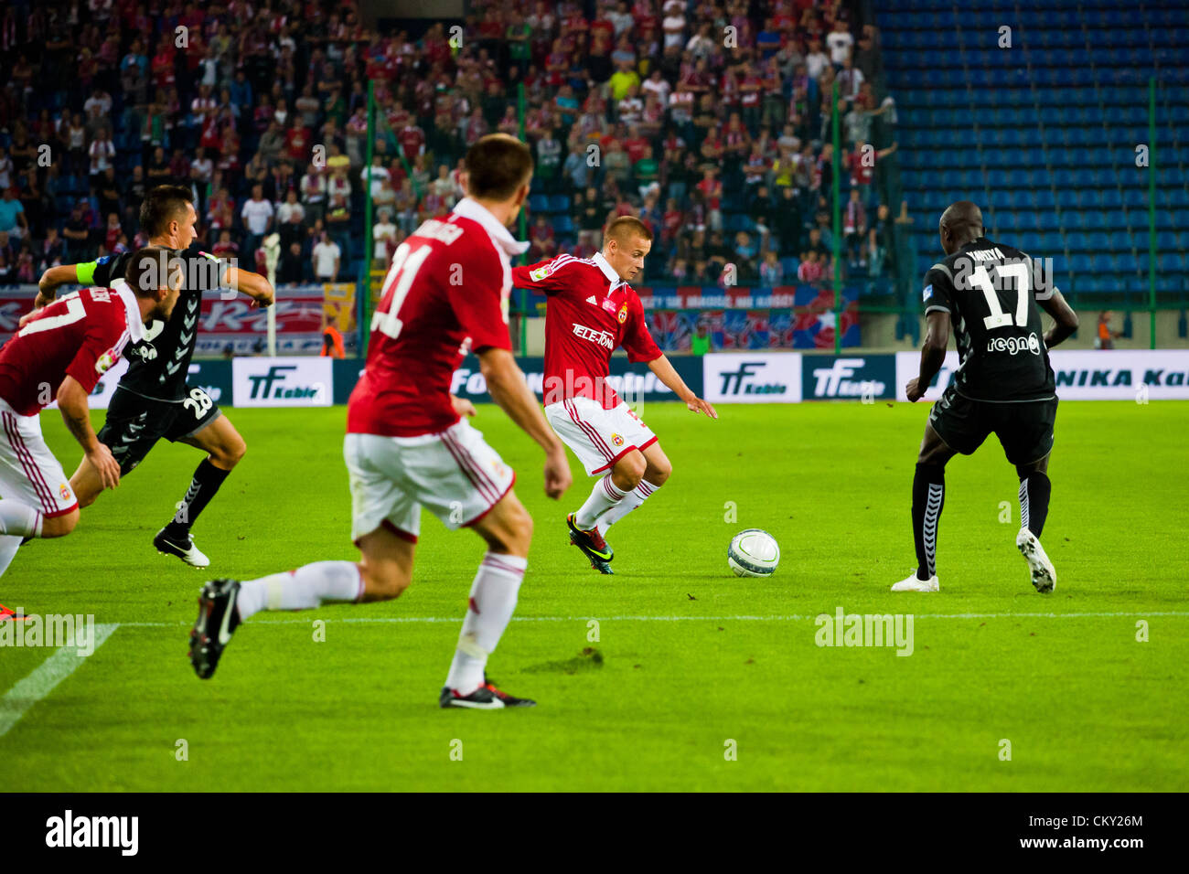 Agosto 31, 2012 a Cracovia (pol. Cracovia), Polonia - terzo round del calcio polacco Extraleague. (C) Dawid Kaminski in azione durante il Wisla Cracovia v Polonia Warszawa corrispondono. Wisla fu sconfitto 1:3 dalla Polonia. Foto Stock