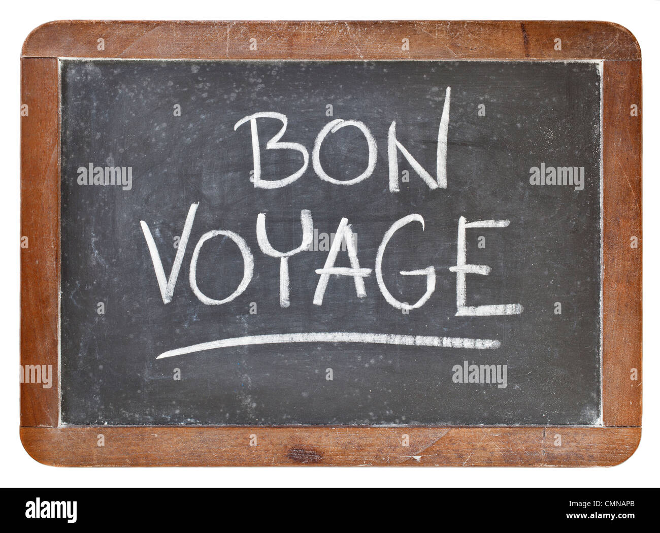 Bon voyage - viaggio di addio o concetto - bianco gesso calligrafia su isolati ardesia vintage blackboard Foto Stock