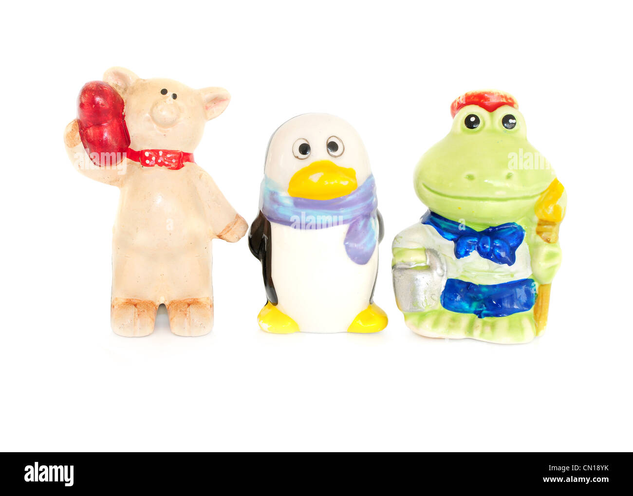 Tre animali in porcellana - maiale, penguin e rana Foto Stock