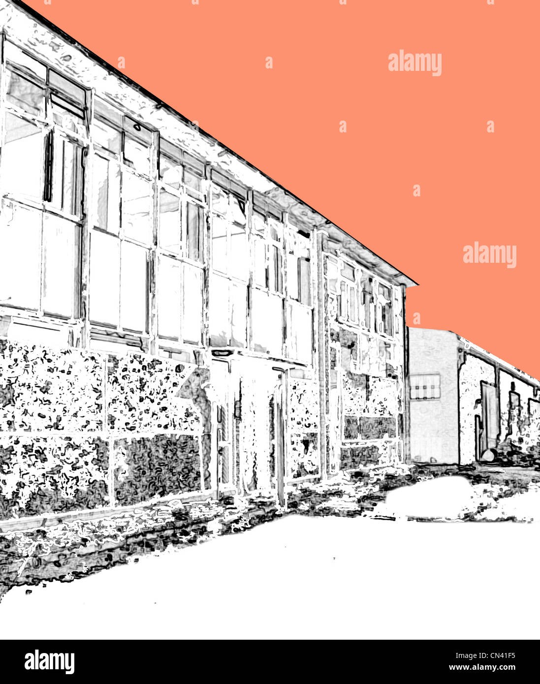 Cielo colorato dietro deadpan e brutto industriale edifici britannici dal nord dell'Inghilterra. Foto Stock