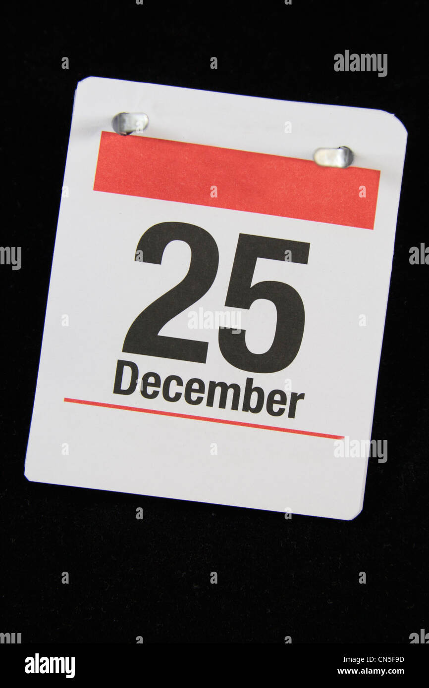 Piccola pagina di calandra per il giorno di Natale, 25 Dicembre su uno sfondo nero. Foto Stock