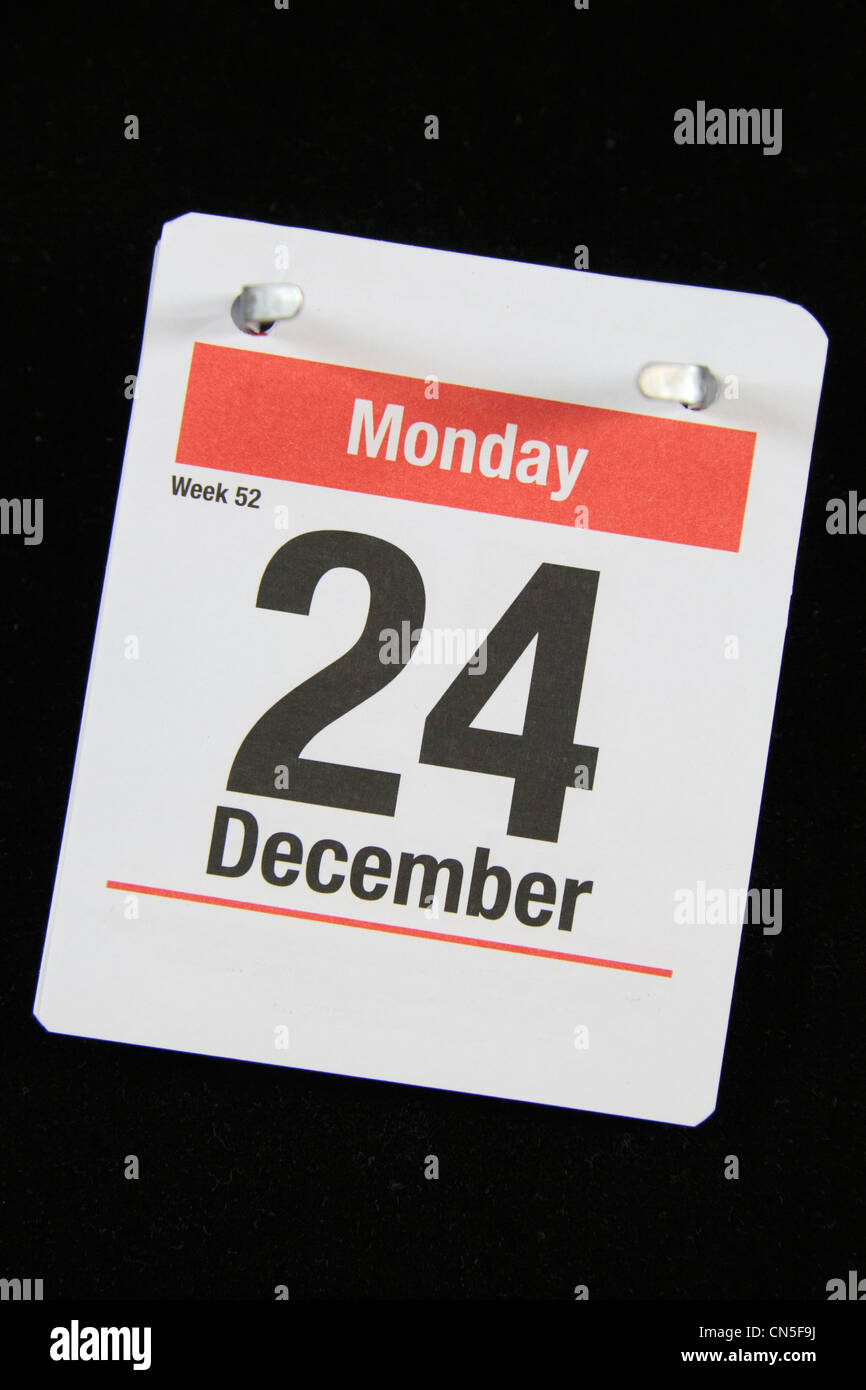 Piccola pagina calandra per la Vigilia di Natale, lunedì 24 dicembre su uno sfondo nero. Foto Stock