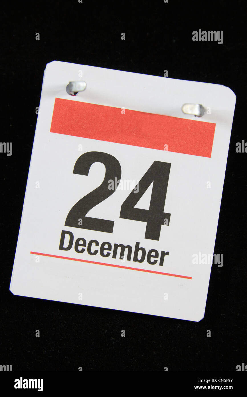 Piccola pagina calandra per la Vigilia di Natale, 24 Dicembre su uno sfondo nero. Foto Stock