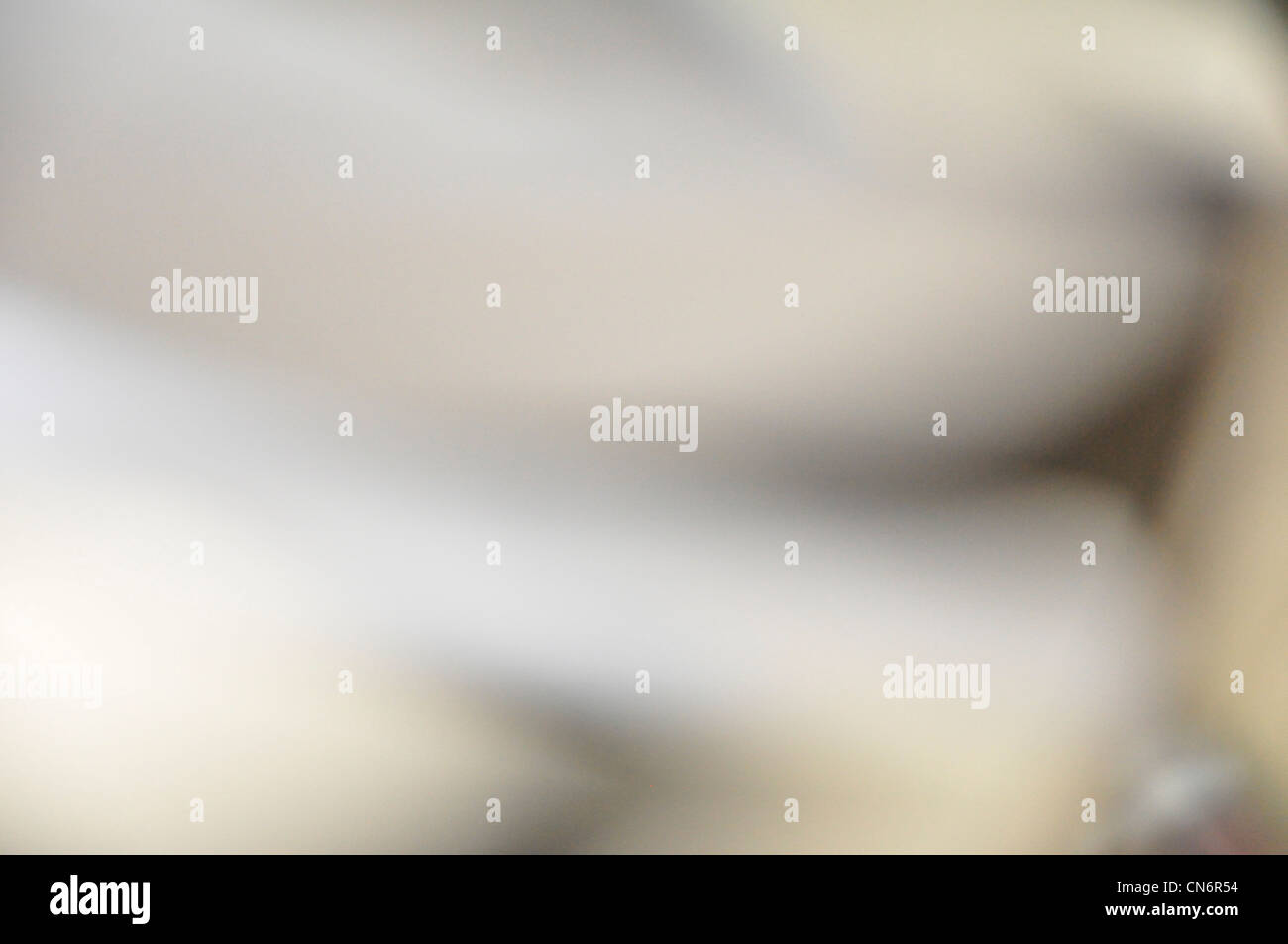 Non focalizzato astratto bianco sullo sfondo grigio Foto Stock