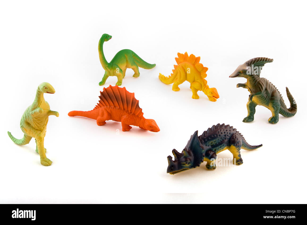 Gruppo del giocattolo dinosauri in plastica su bianco Foto Stock