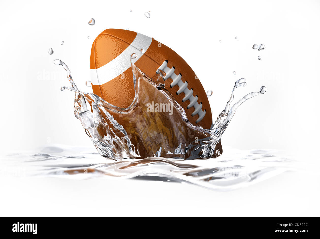 American Football pallina cadere in acqua chiara, formando una corona splash. Su sfondo bianco, con profondità di campo. Foto Stock
