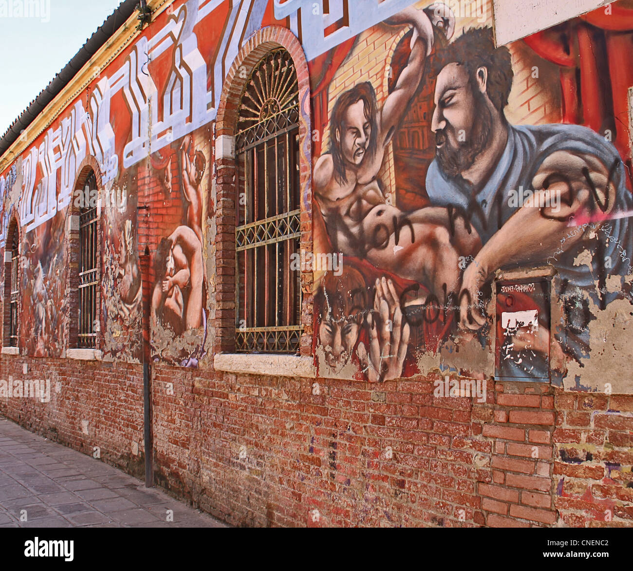 Venezia - Incredibile graffiti su un mattone di edificio industriale a Venezia, Foto Stock