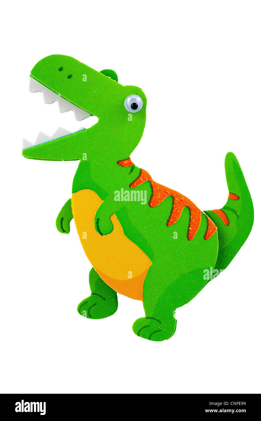 Close up di un divertente e sciocco, verde e arancione T-rex dinosauro con googly occhi su sfondo bianco Foto Stock
