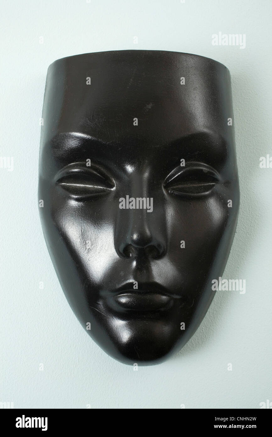 Una maschera nera, femmina somiglianza Foto Stock