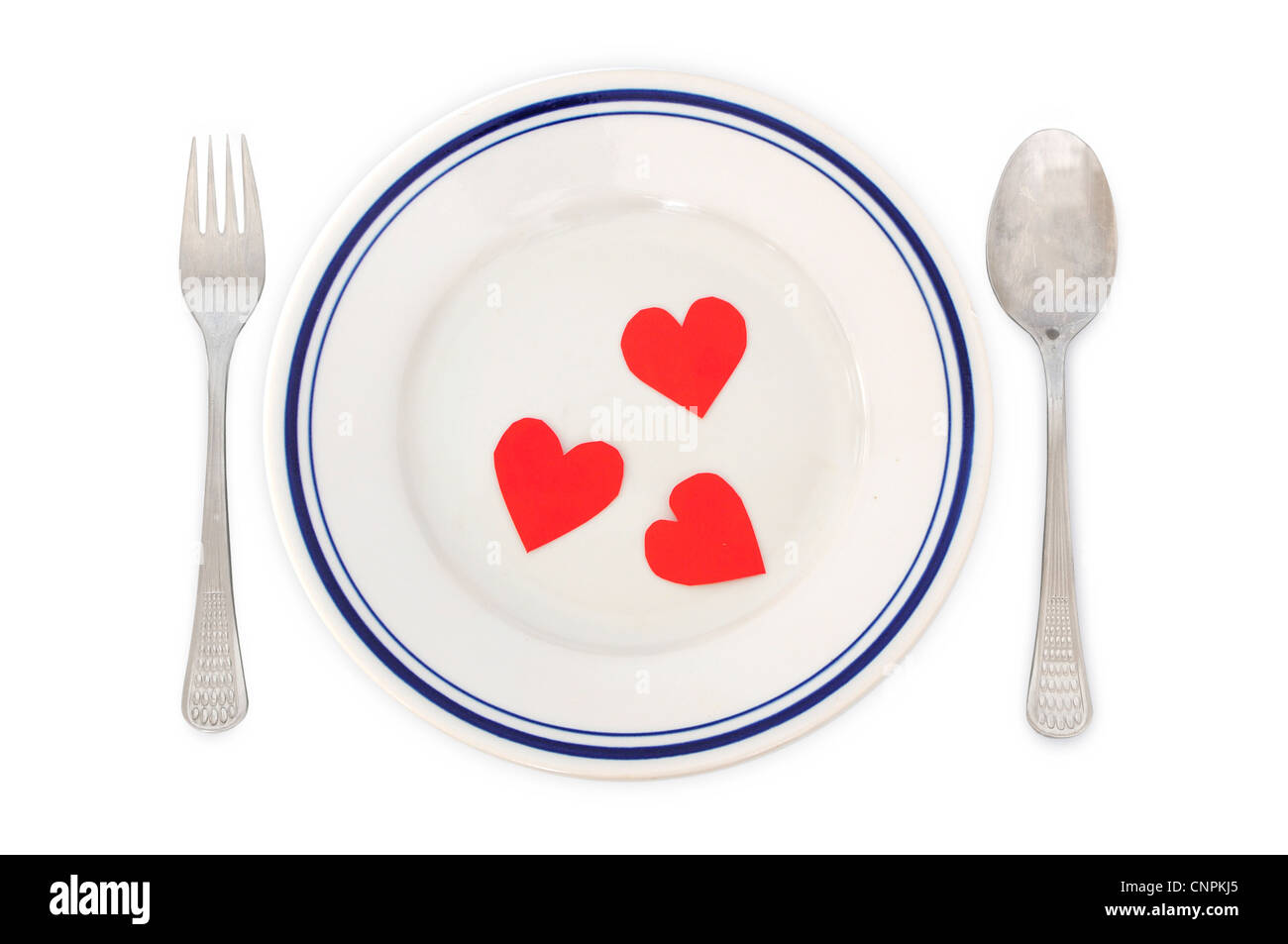 Concetto di amore - a disposizione per la cena con forme di cuore nella piastra Foto Stock