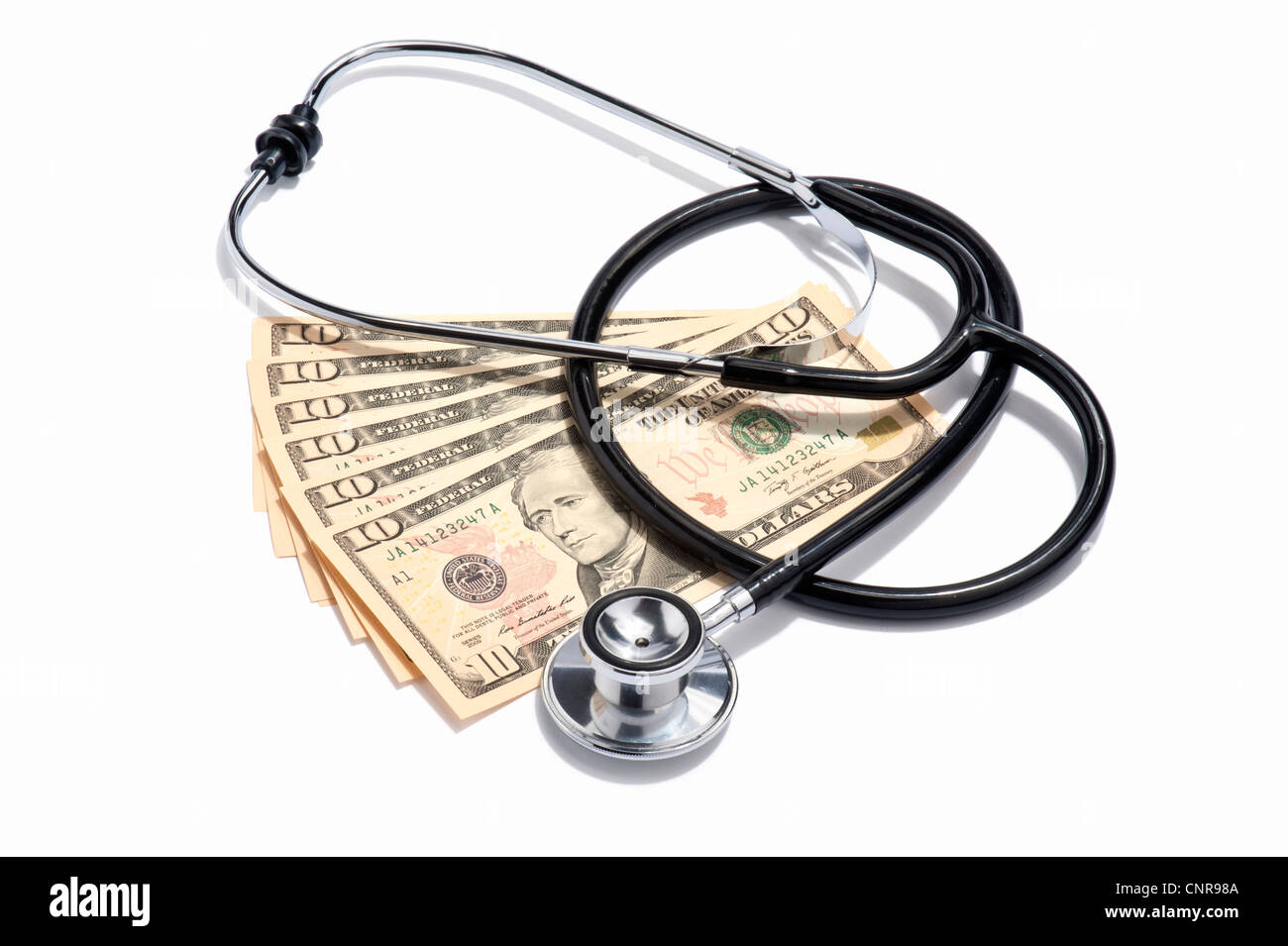 Un medici lo stetoscopio e il dollaro USA note Foto Stock