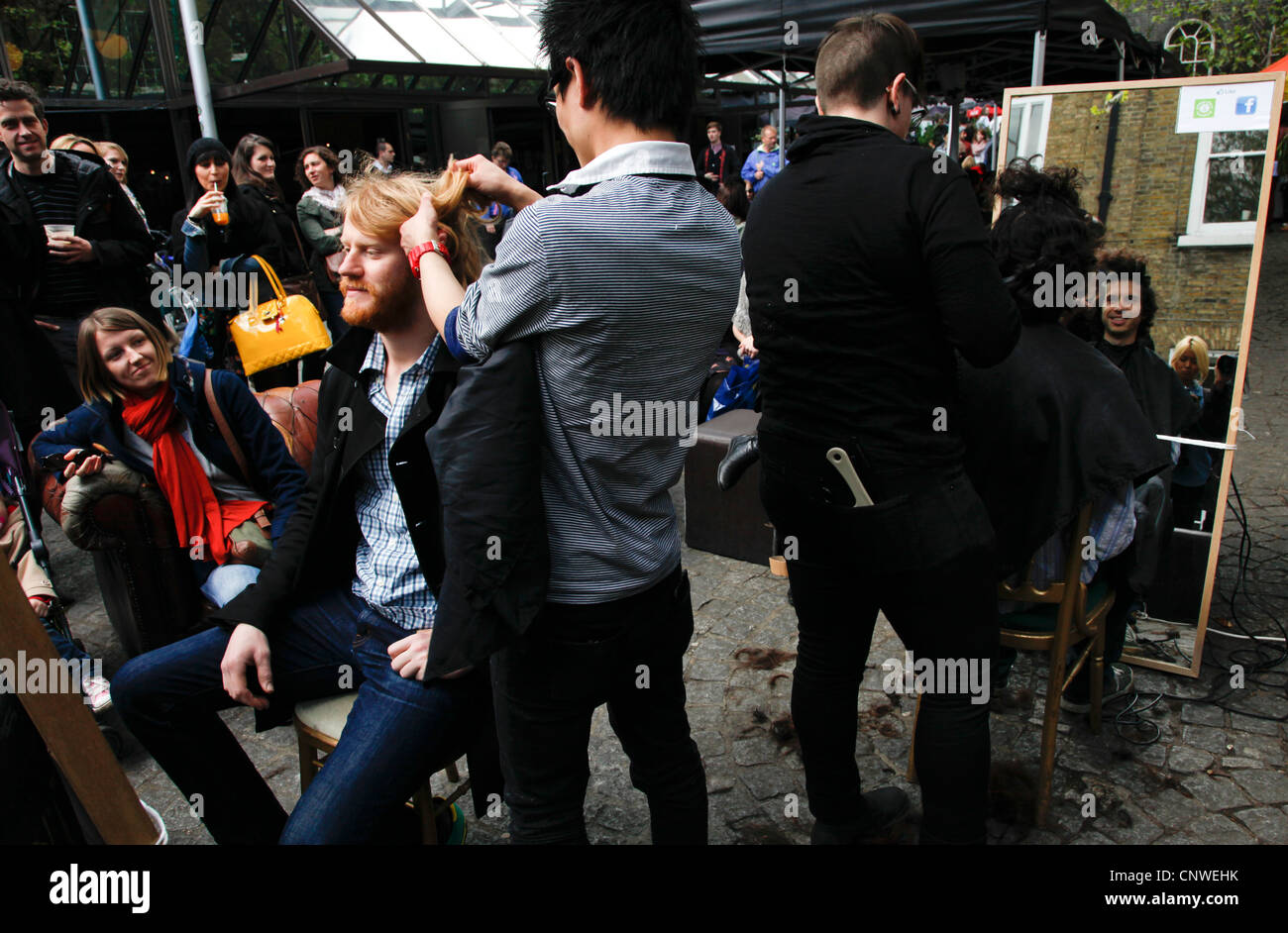 Street parrucchieri in Brick Lane, London, Regno Unito Foto Stock