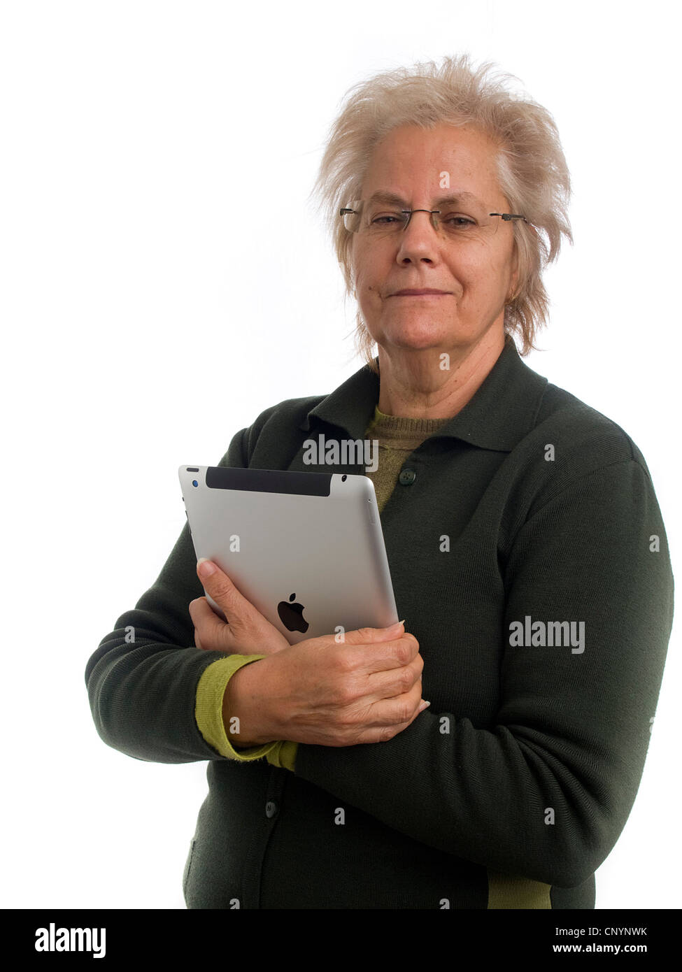 Donna matura tramite iPad Foto Stock