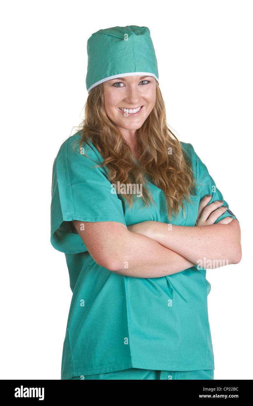 Donna sorridente infermiera indossando scrub verde con cappello chirurgico Foto Stock