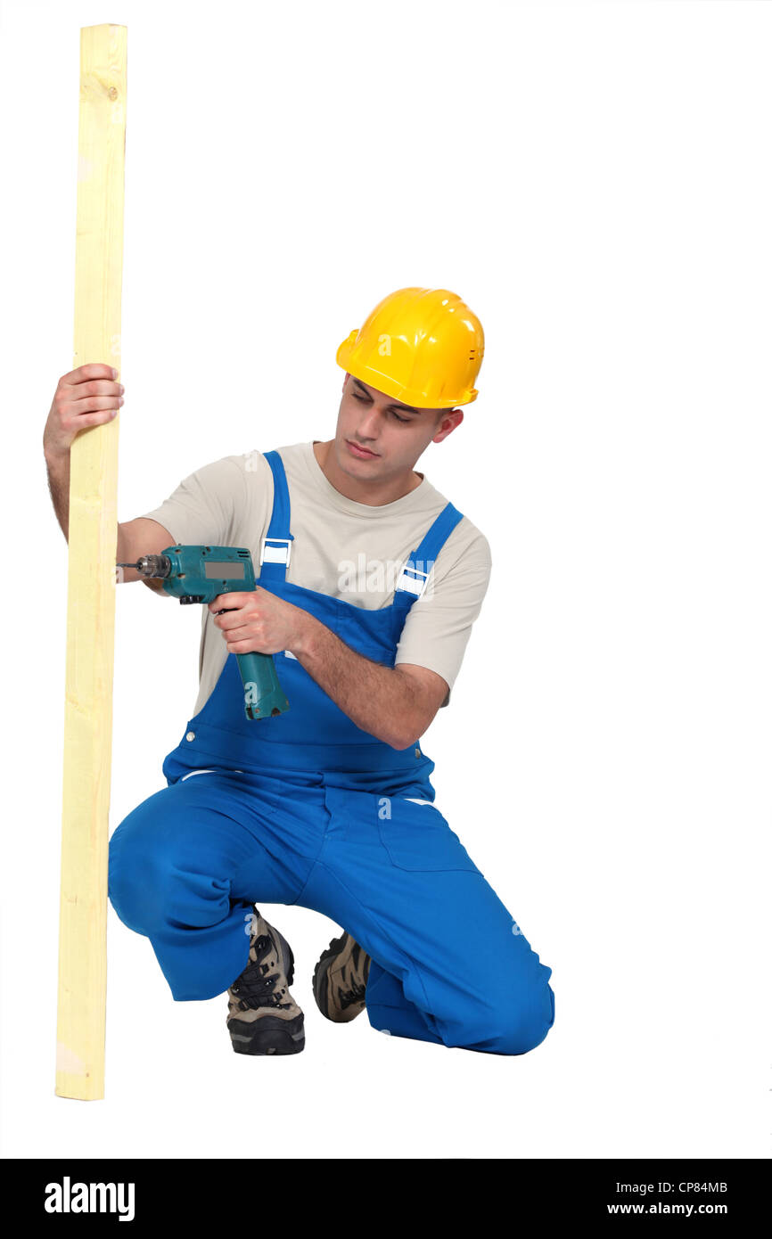 L uomo per forare il legno Foto Stock