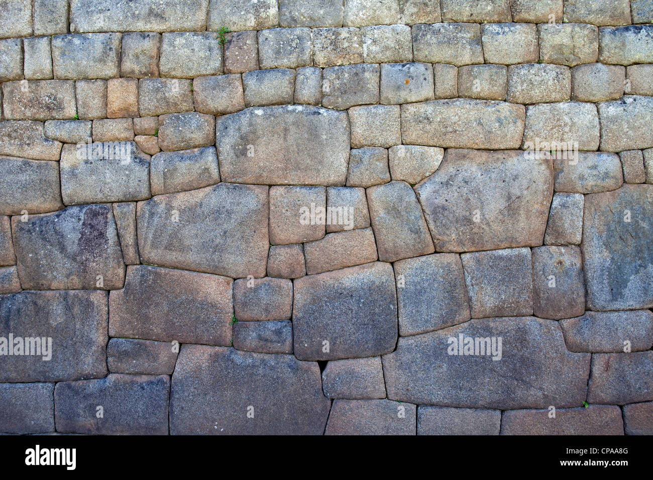 Muro di pietra dettaglio delle rovine di Machu Picchu in Valle Sacra del Perù Foto Stock