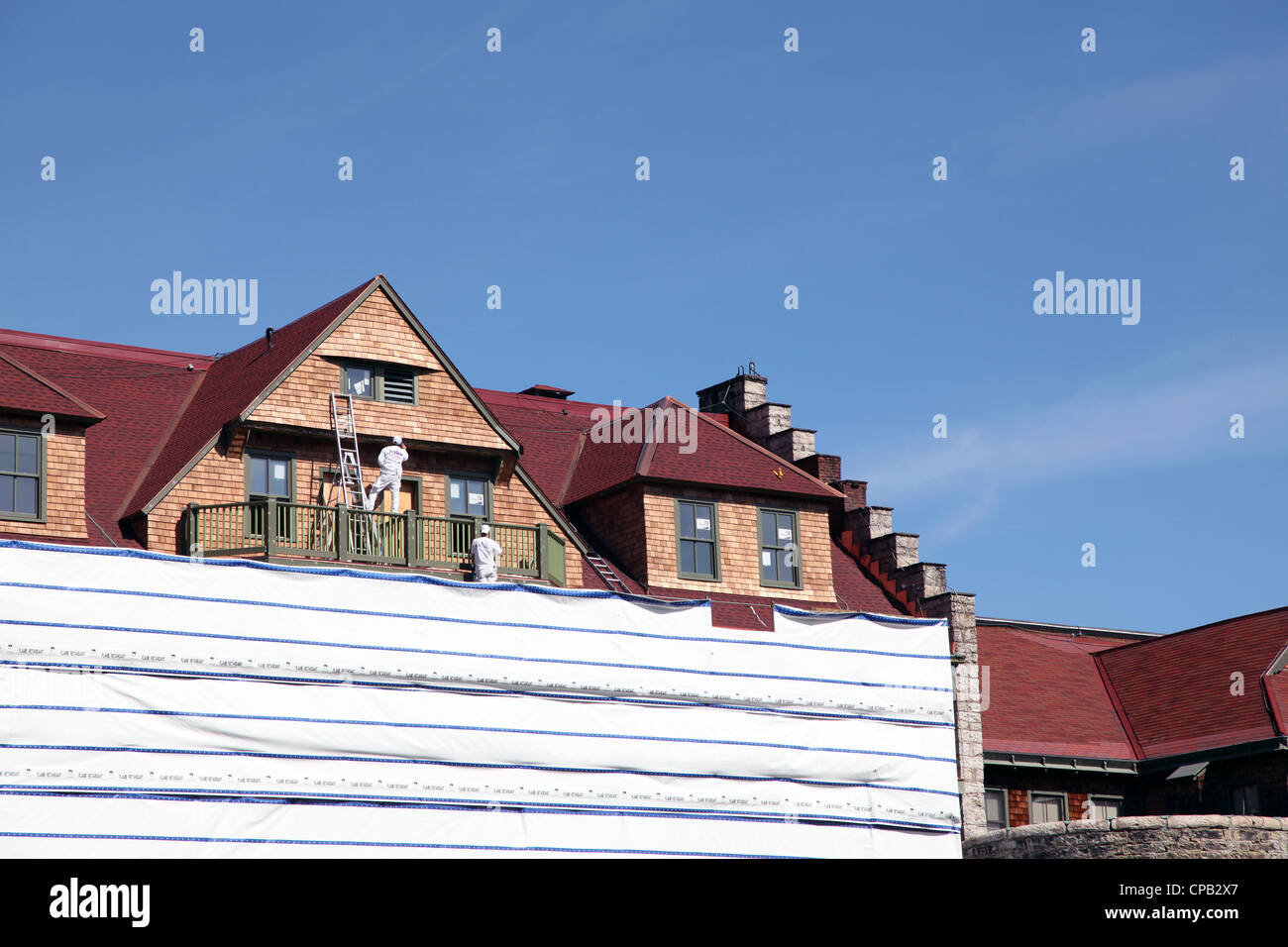 Lavoratori il rinnovamento di facciata a Mohonk Mountain House di New Paltz, NY, STATI UNITI D'AMERICA Foto Stock