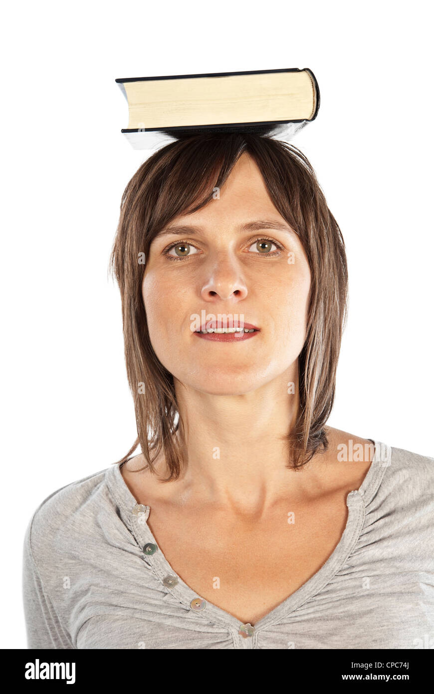 Pretty Woman il bilanciamento di un libro sulla sua testa. Foto Stock