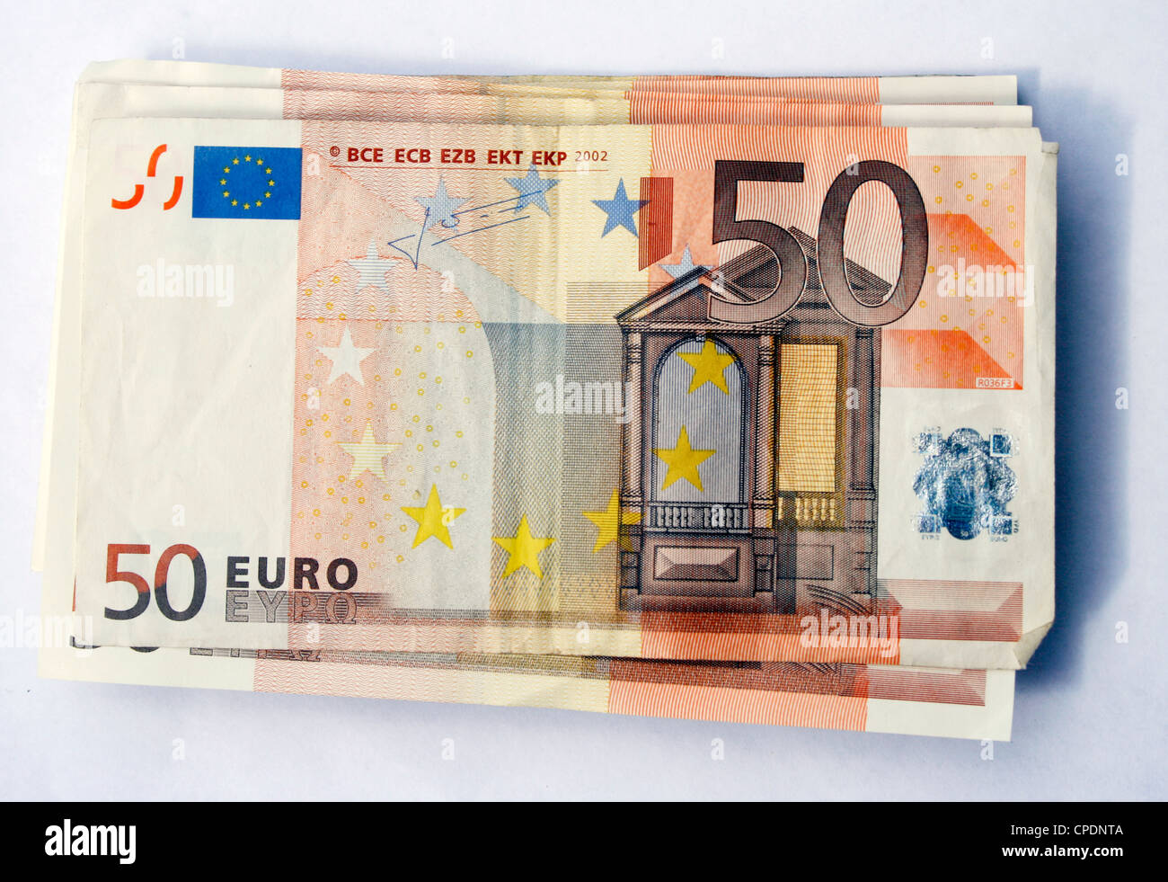 Pila di 50 le banconote in euro con ombra Foto Stock