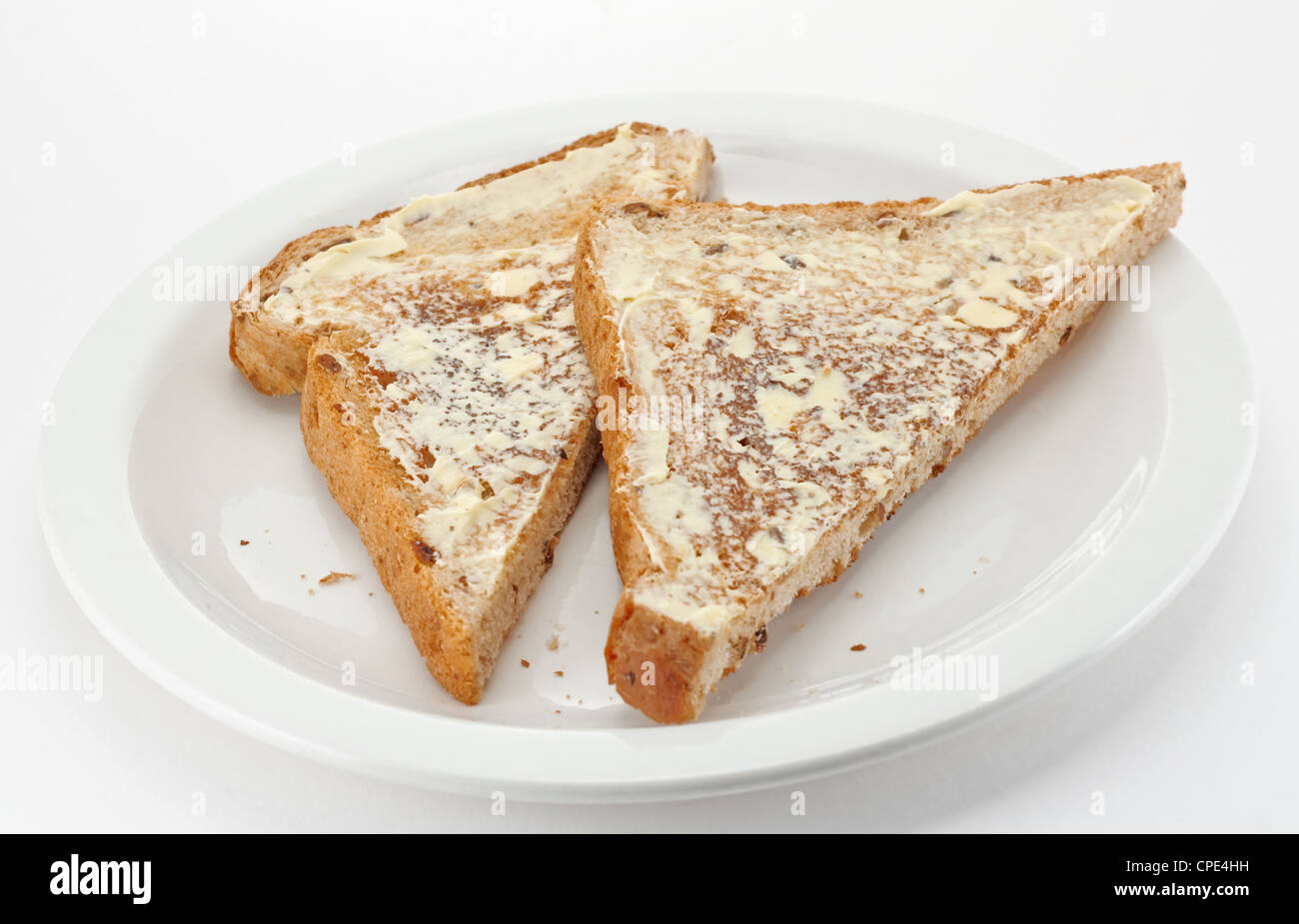 Segale imburrato toast tagliata in triangoli Foto Stock