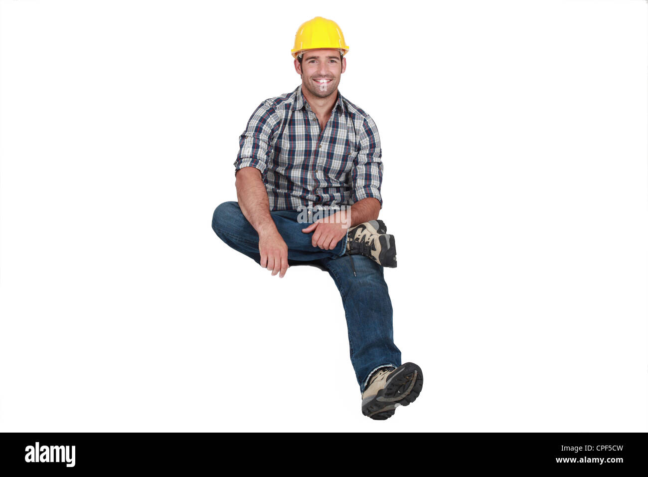 Un lavoratore edile la levitazione. Foto Stock