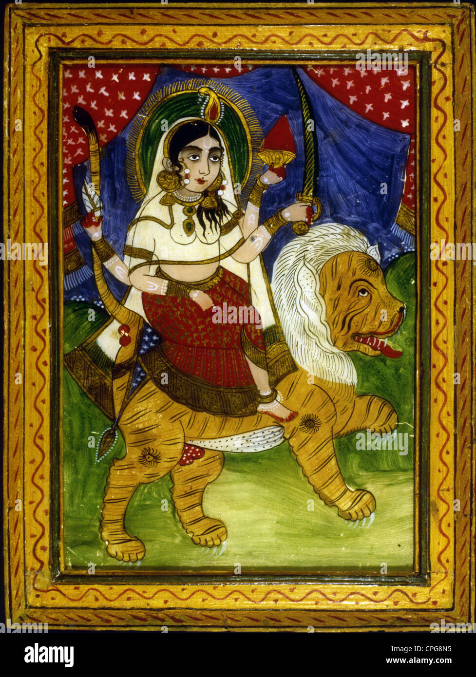 Durga, dea indiana, moglie della Siva (Shakti Siva, conosciuta anche come Parvati, Uma o Kali) cavalcando sulla tigre, Indian reverse painting on glass, undati, Foto Stock
