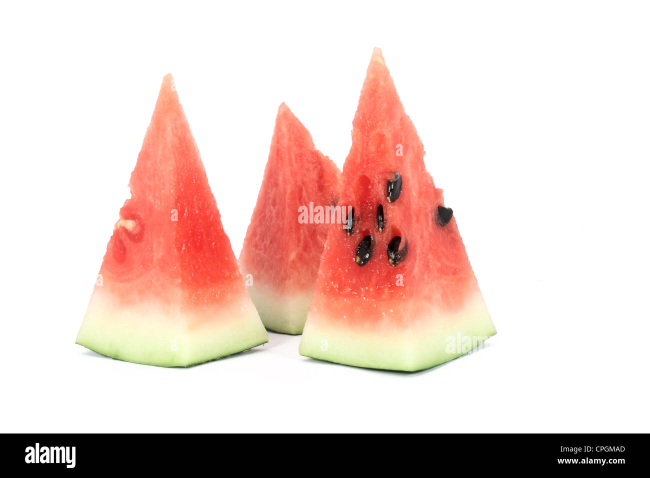 Tre pezzi di melone acqua isolato su bianco Foto Stock