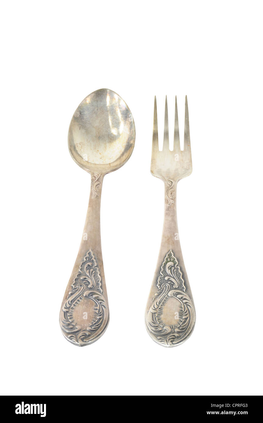 Argento Vintage cucchiaio e forchetta con ornamenti isolati su sfondo bianco Foto Stock